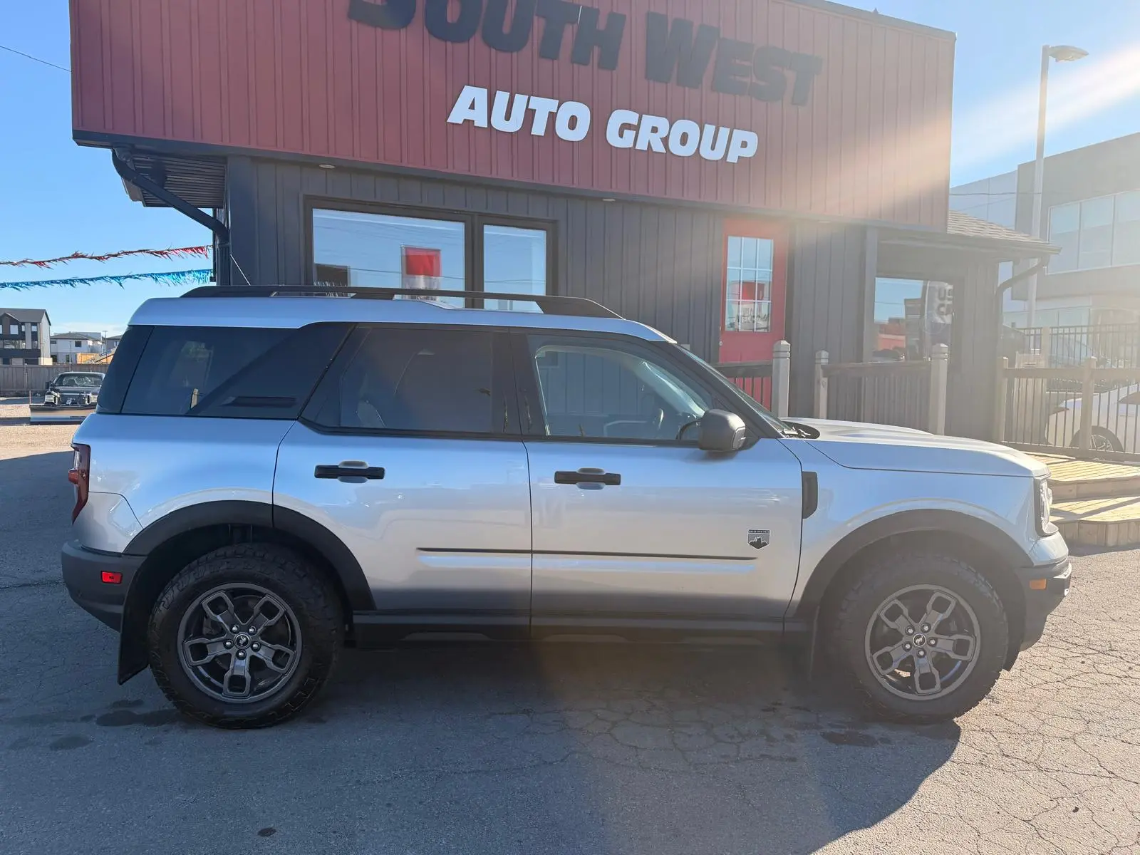 2021 Ford Bronco Sport Big Bend Silver right side exterior view with alloy wheels parked at dealership.