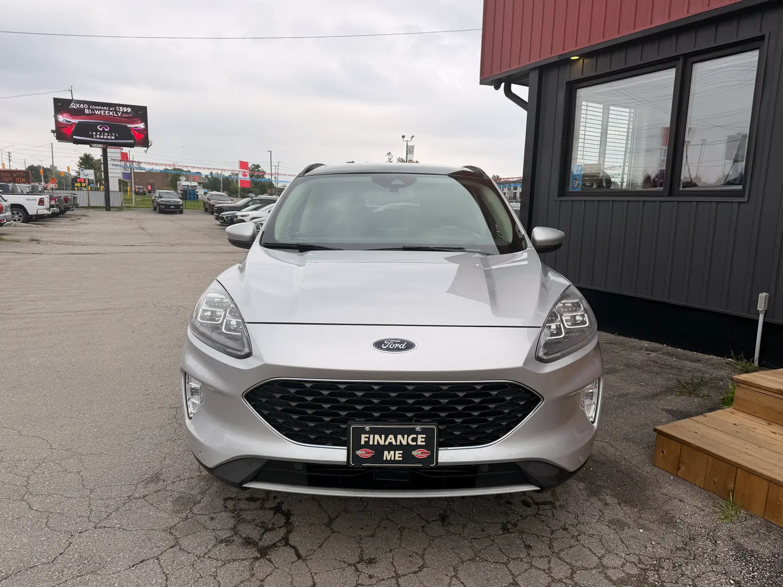2020 Ford Escape Titanium Silver front exterior view at dealership with Finance Me license plate and LED headlights visible.