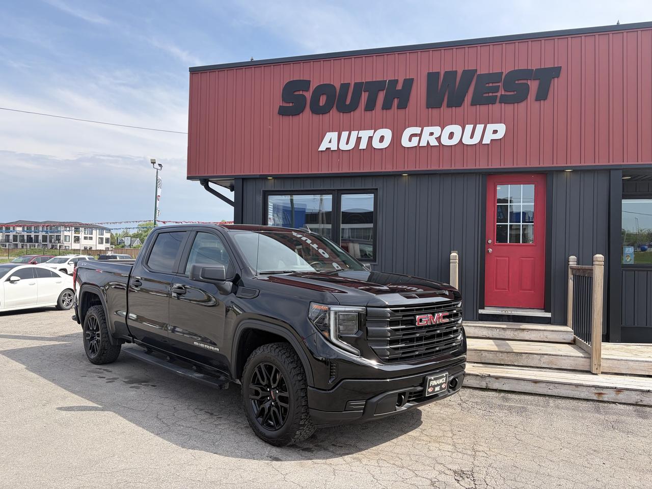2023 GMC Sierra 1500 Pickup Truck Black front three-quarter exterior view with dark alloy wheels parked at dealership.