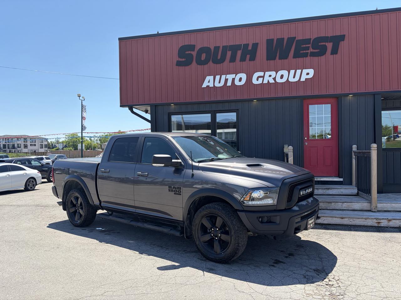 2021 RAM 1500 Classic Pickup Truck front three-quarter exterior view with black alloy wheels parked at dealership lot.