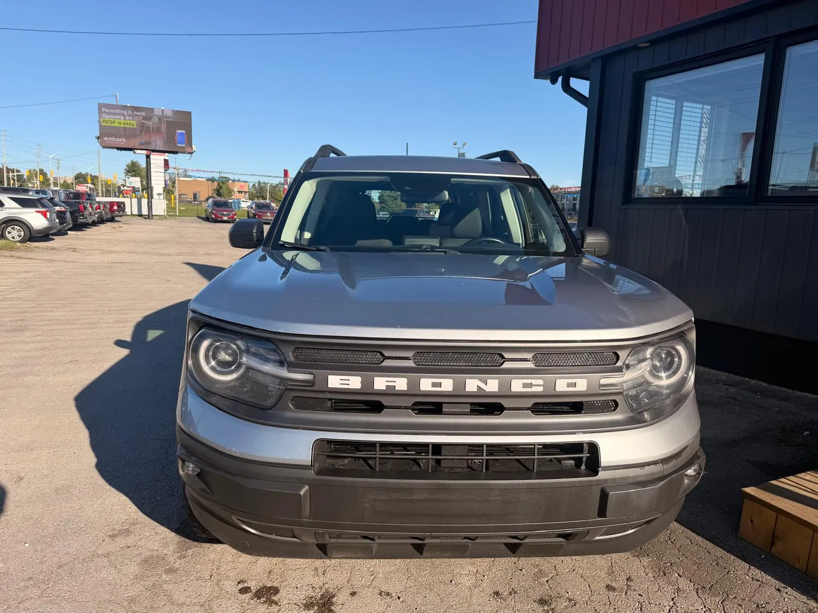 2021 Ford Bronco Sport Big Bend Silver front exterior view parked in lot with circular LED headlights and BRONCO badging visible.