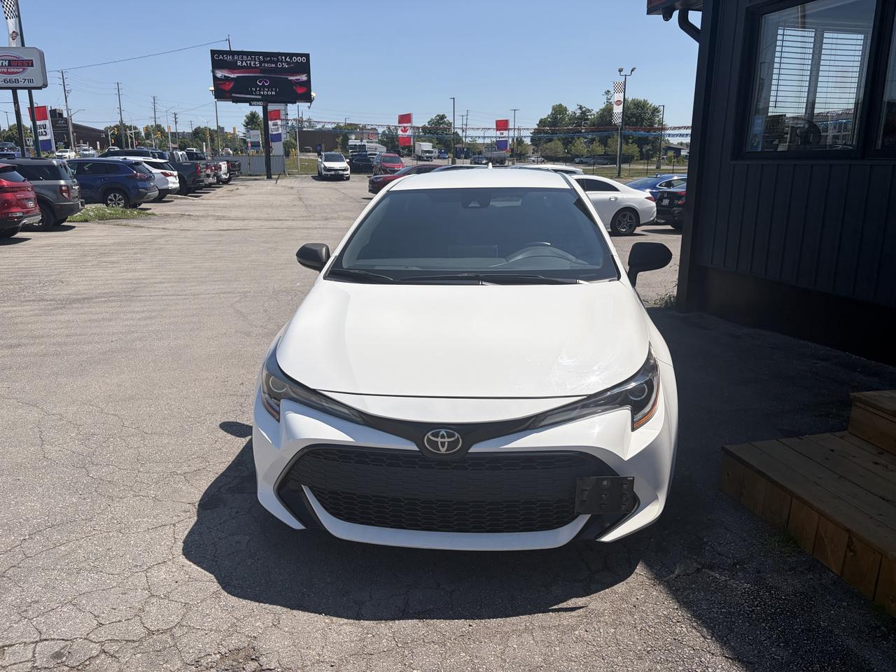 2020 Toyota Corolla Sedan White front exterior view parked at dealership lot in daylight.